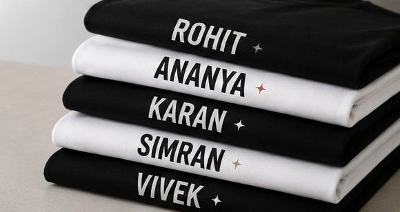 Stacked personalised T-shirts with printed names