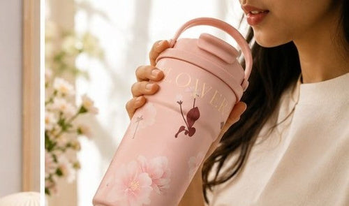 Blush Pink floral thermal tumbler being used for sipping