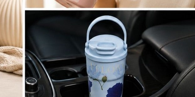 Sky Blue floral thermal tumbler in a car cup holder