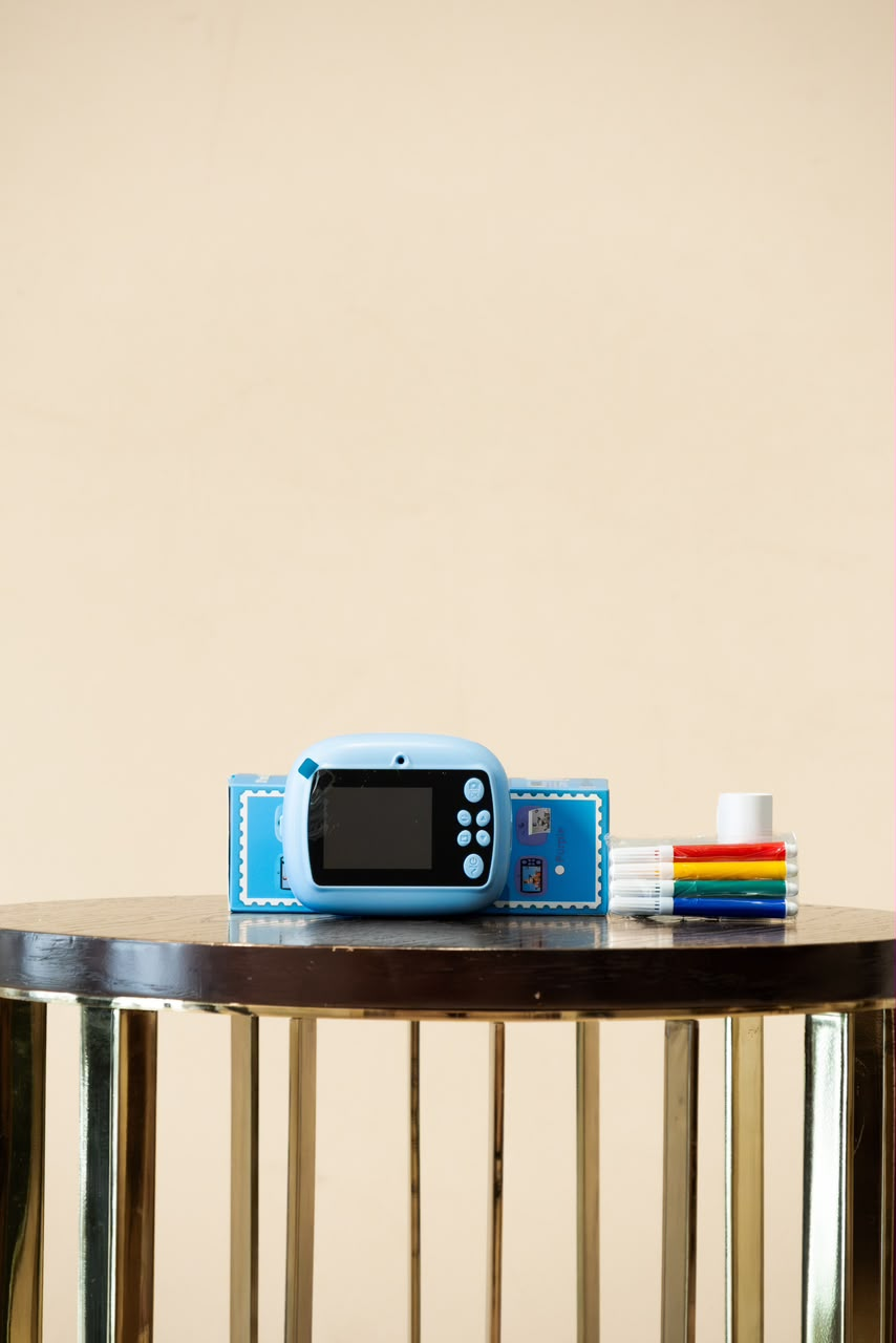 Blue mini digital camera rear screen and controls with markers