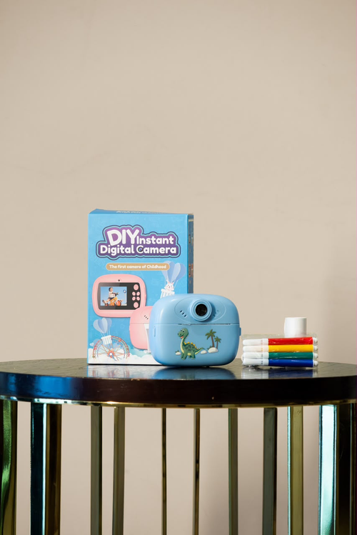 Blue mini digital camera with retail box and coloured markers