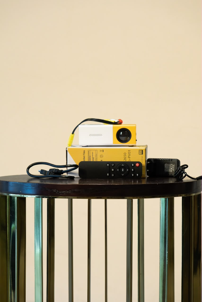 Mini movie projector with remote, cables, adapter and retail box