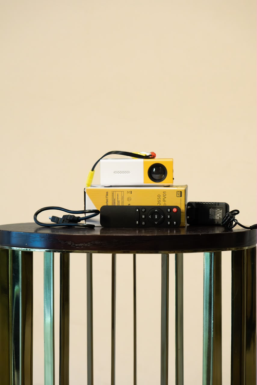 Mini movie projector with remote, cables, adapter and retail box