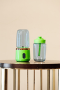 Green portable juicer and matching tumbler front view
