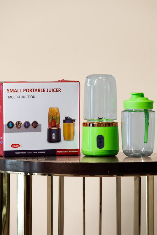 Green portable juicer and tumbler with retail box